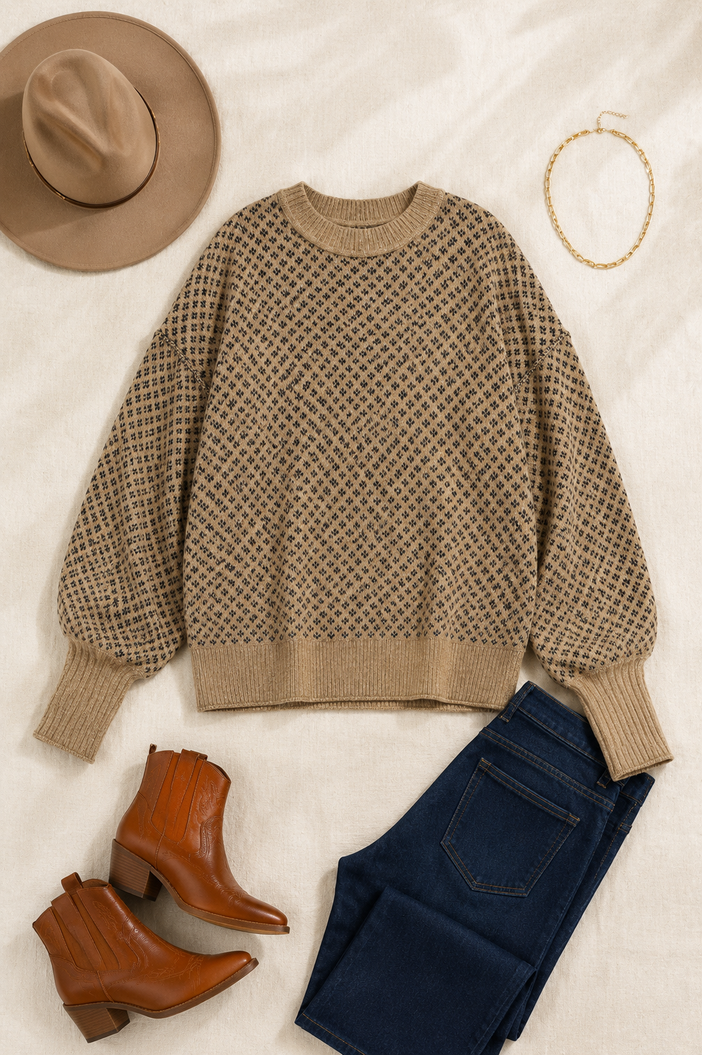 Khaki geometric knit sweater styled with dark jeans, cognac Western boots, tan felt hat and gold necklace.