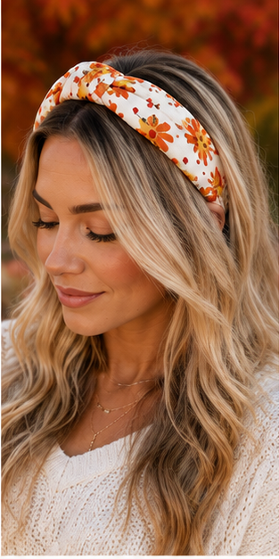 Blonde woman styling ivory turkey print knotted headband with a cream sweater