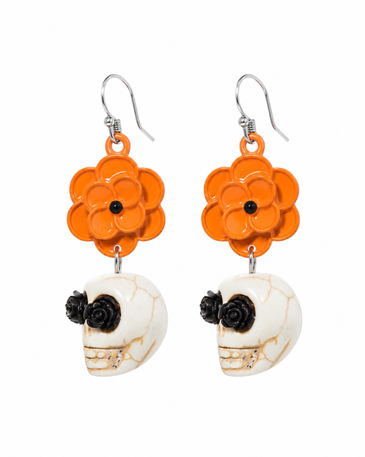 Marigold Mourning skull earrings with orange flower drops, ivory skulls and black rose details on a white background