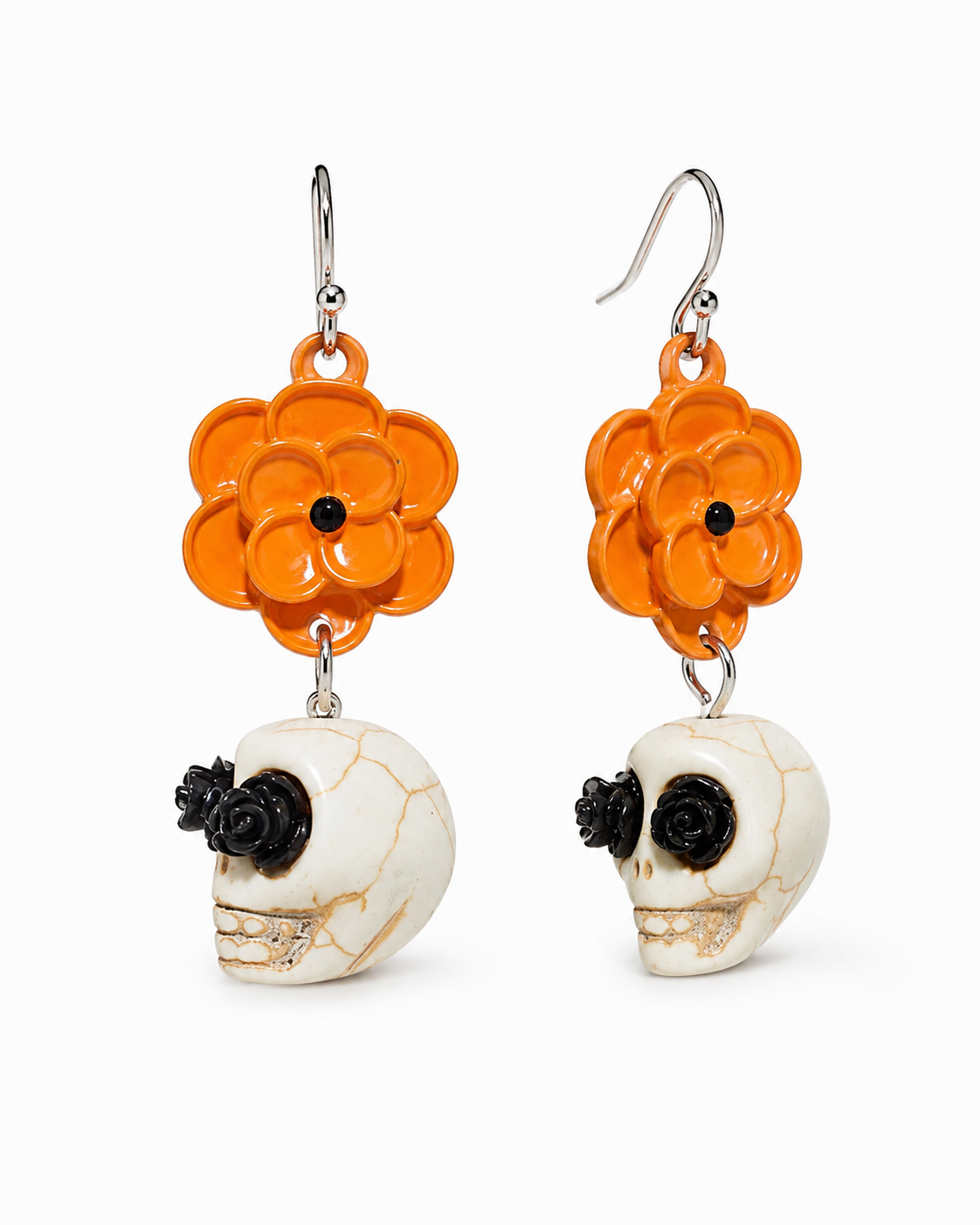 Front and side view of Marigold Mourning earrings showing dimensional flower layers, skull charms and silver-tone hooks