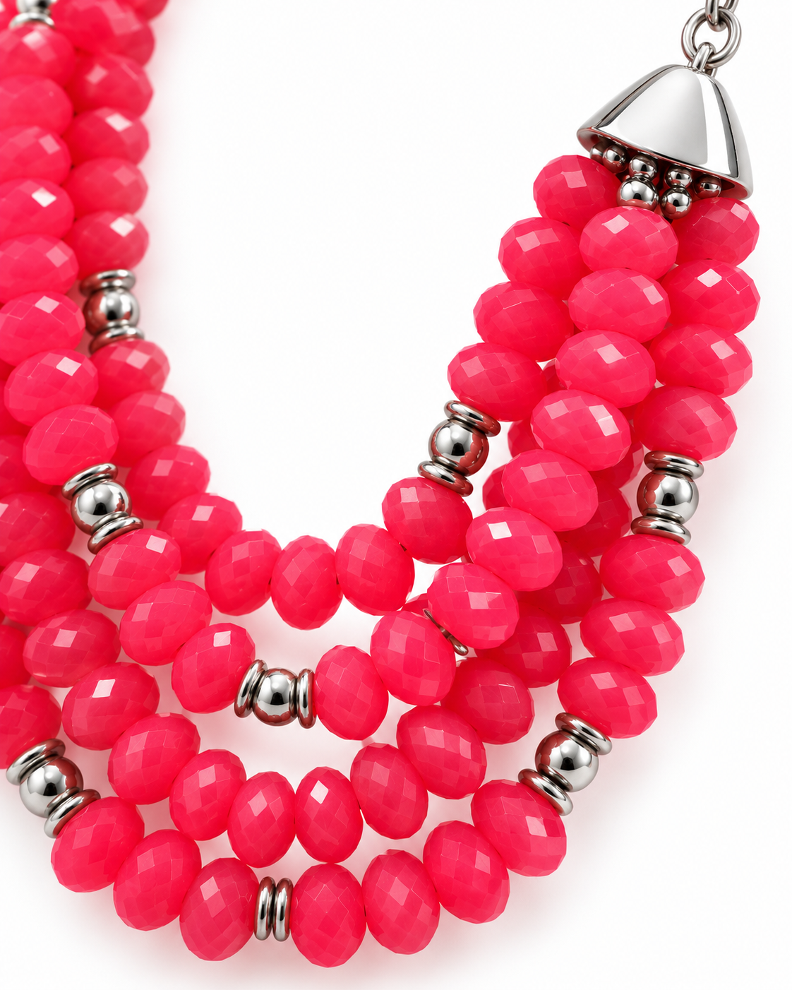 A multi-strand statement necklace featuring vibrant hot pink faceted beads and small metallic silver spacer beads, with a silver conical clasp visible at the top right, set against a plain white background.