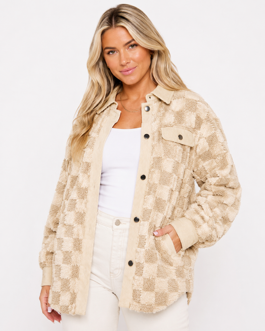 High Plains Plush Check Shacket in cream and khaki styled over a white tank with light neutral denim on a white background.