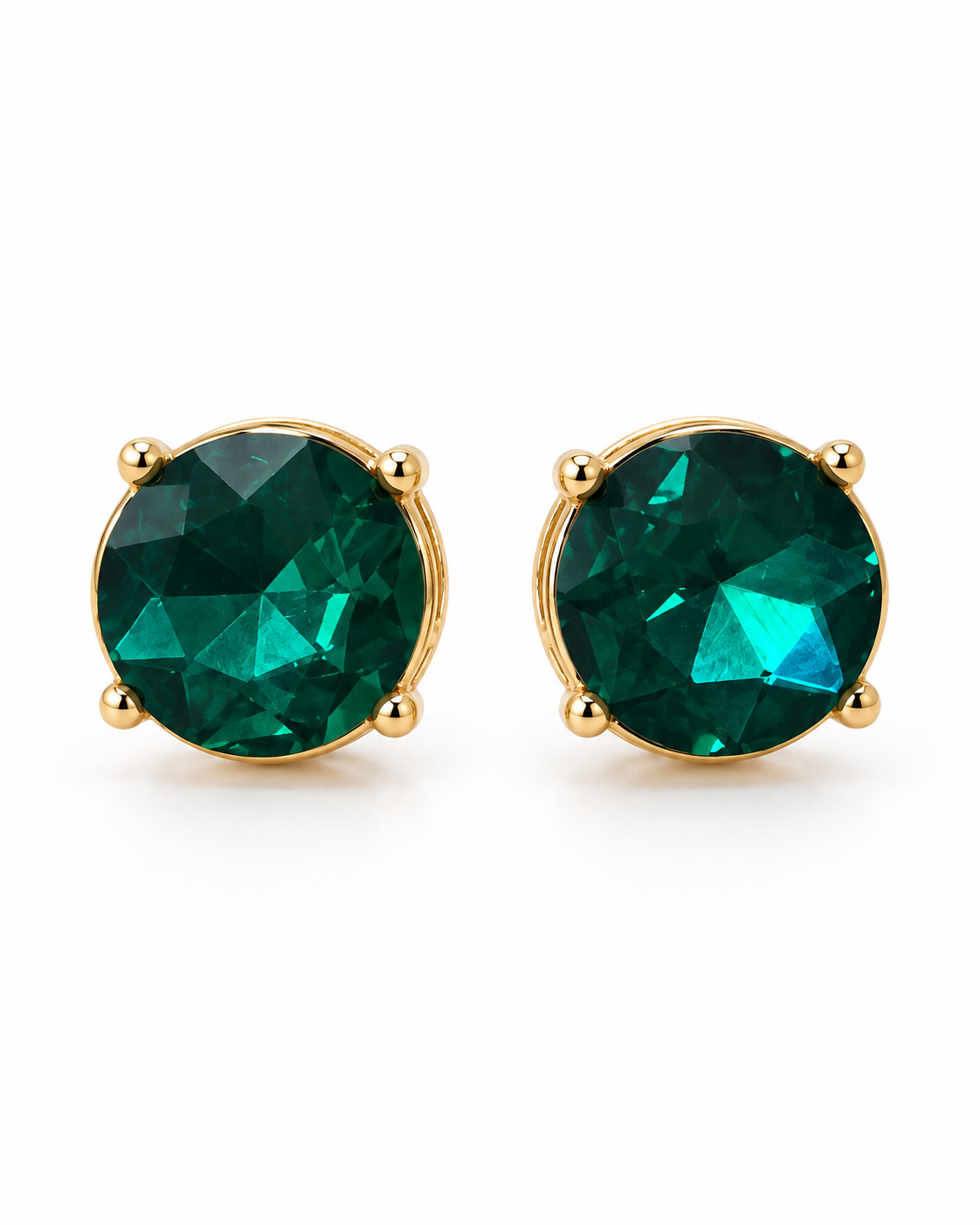 A pair of gold stud earrings with round faceted green gemstones, set in a four-prong gold setting against a plain white background.