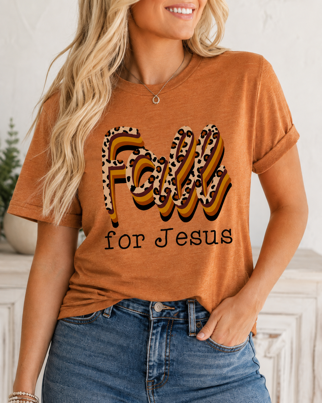 Tight crop clearly showing the leopard-print and retro striped FALL lettering.