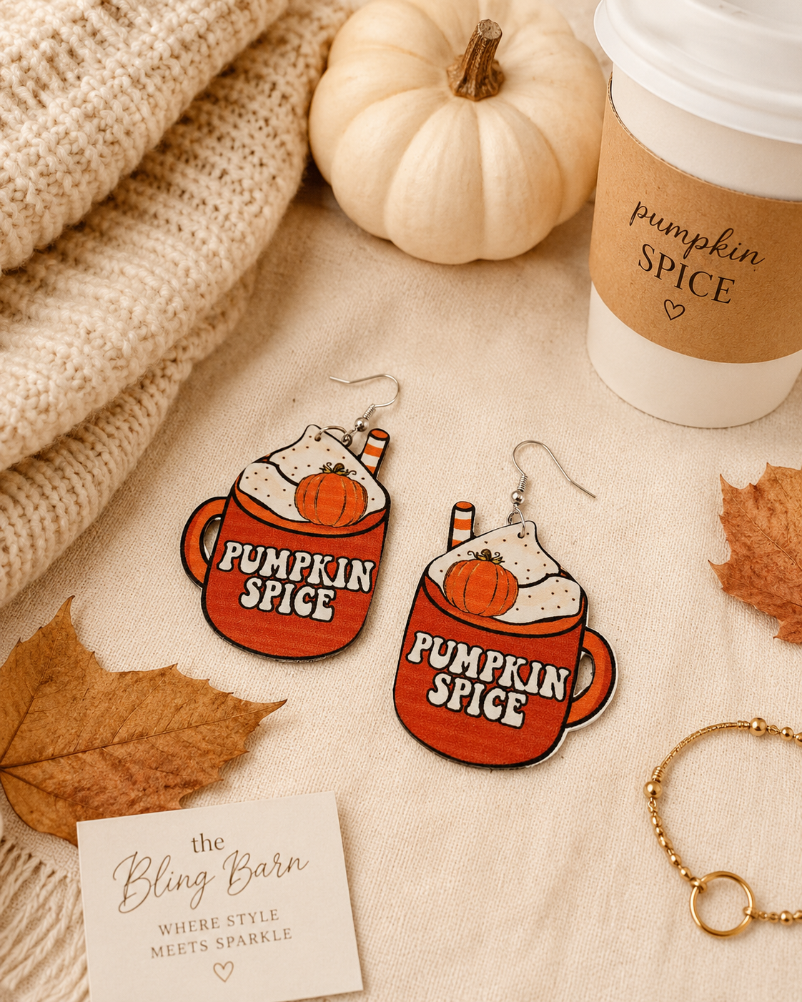 Emma styling the Pumpkin Spice Season Earrings with a simple black top and denim for an After Dark fall look.