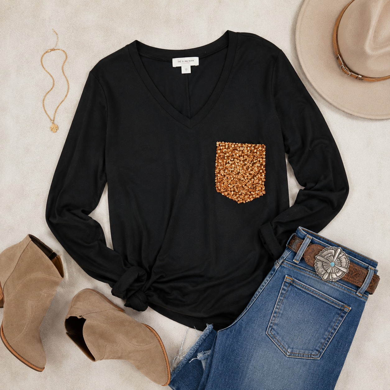Black top, denim, cognac leather, gold jewelry and the sequin pocket as the focal point.
