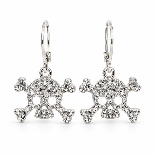 A pair of silver leverback earrings featuring skull and crossbones charms paved with clear rhinestones, shown against a plain white background.