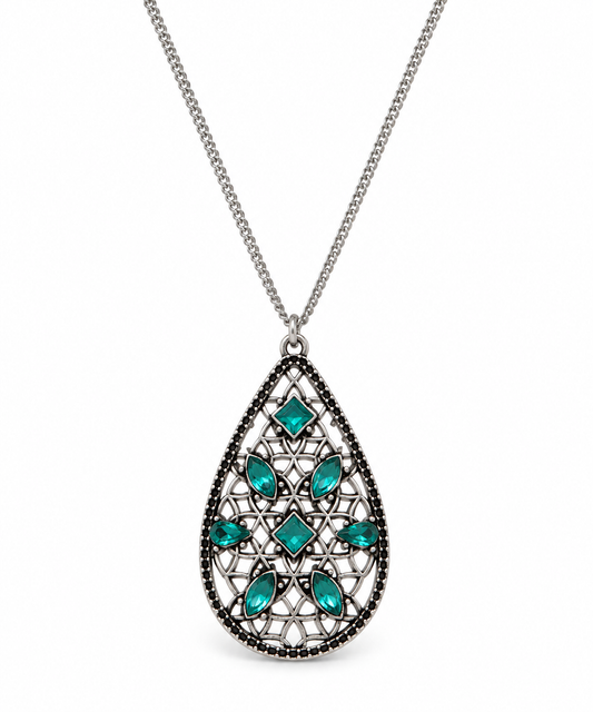 A silver teardrop pendant necklace featuring a filigree design with turquoise green gemstones and a border of small dark stones, shown on a white background.