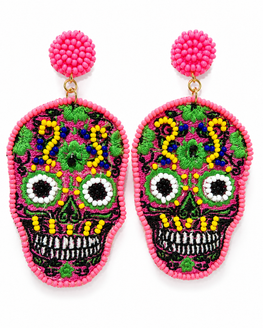 Fiesta Calavera beaded sugar skull earrings with hot pink studs on a clean white background