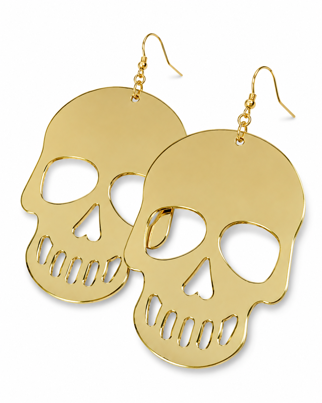 Close-up of oversized mirrored gold skull earrings showing reflective finish and cutout details