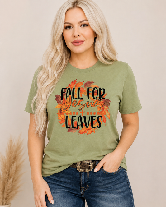 Sage tee, medium-wash denim, cognac belt and subtle turquoise jewelry.