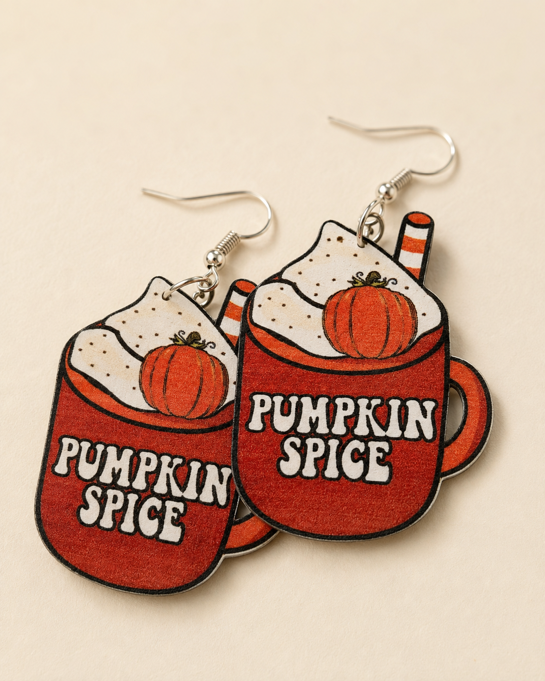 Close-up detail of the Pumpkin Spice Season Earrings showing the printed mug design and silver-tone hooks.