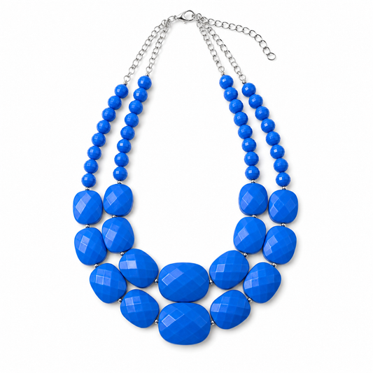 Cobalt Ridge double-strand statement necklace with vivid blue faceted beads and silver-tone chain on white background