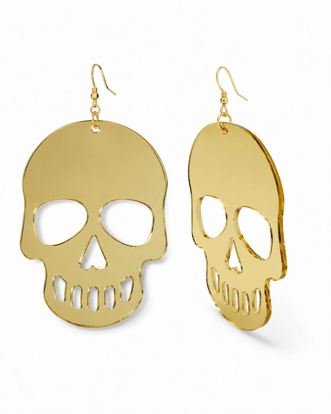 Side-angle view of gold skull earrings showing lightweight profile and gold fishhook ear wires