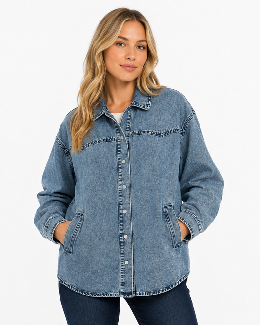 Dusk Blue Western Tunic Denim Jacket on model, featuring an oversized fit, snap front, western yoke stitching and washed denim finish.