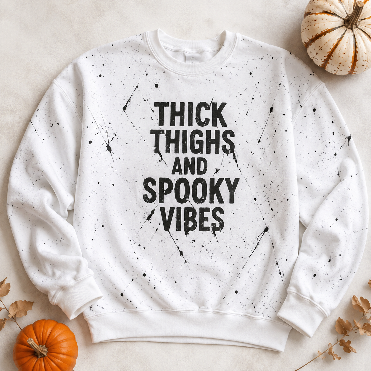 Thick Thighs & Spooky Vibes white crewneck sweatshirt flat lay with pumpkins and neutral fall décor